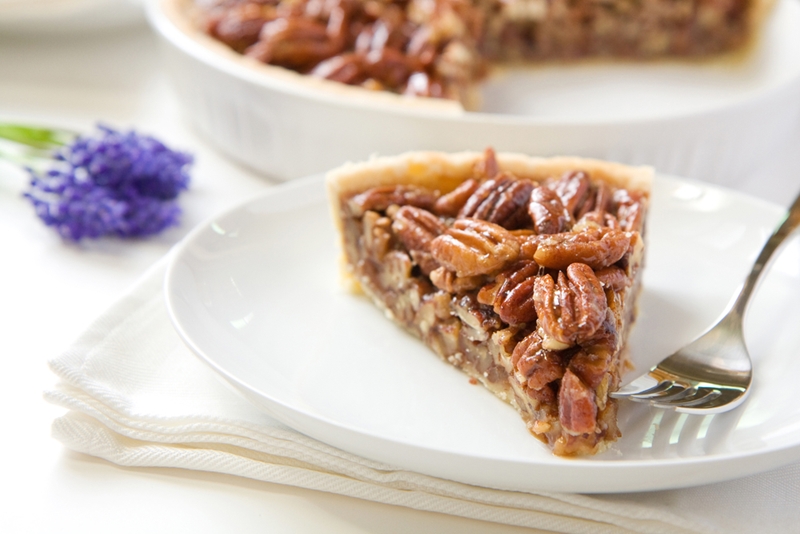 slice of pecan pie on a white plate